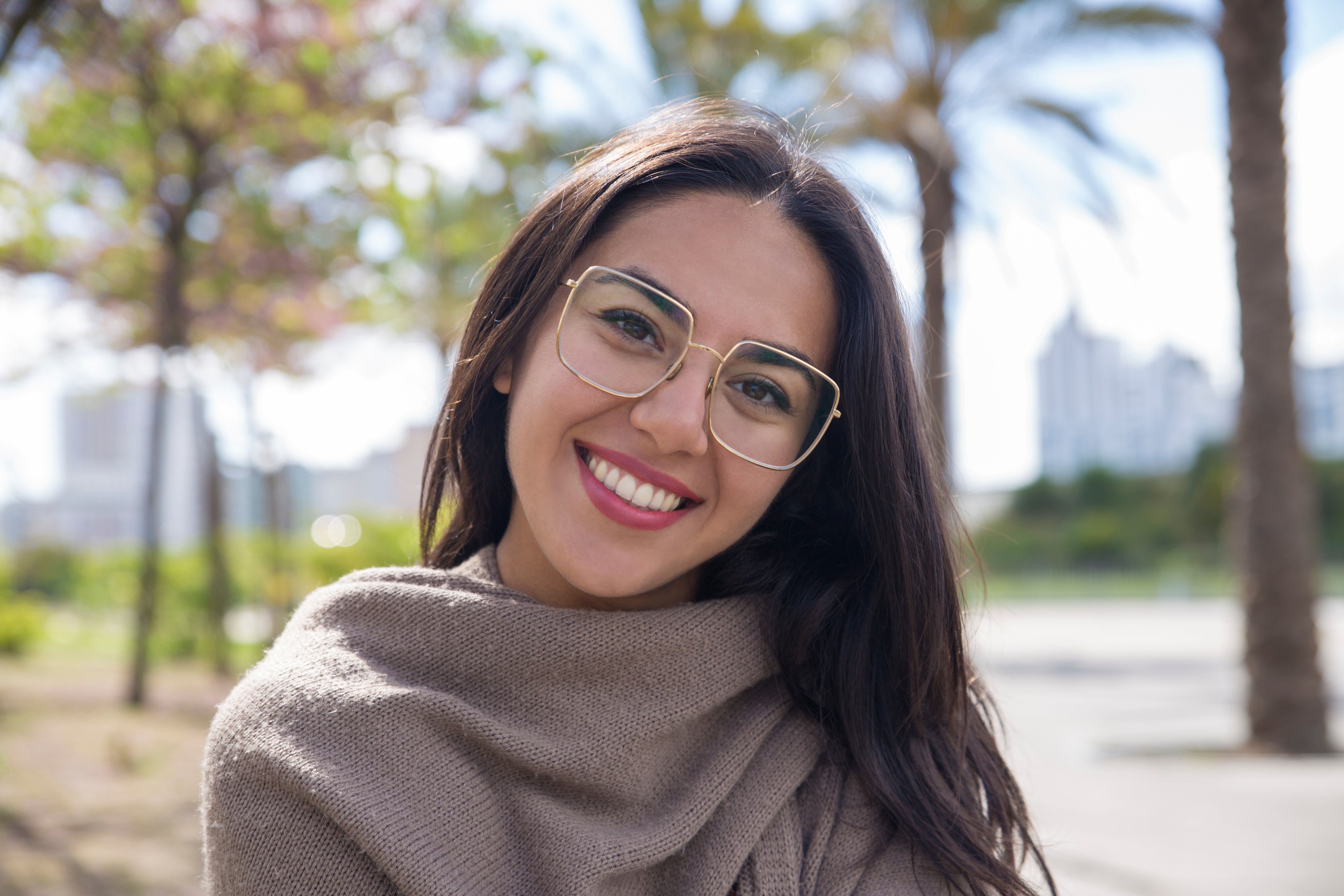 files/happy-pretty-young-woman-posing-camera-city-park.jpg